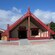 A traditional carved wooden meeting house at Māori cultural site